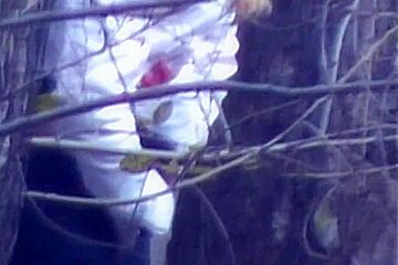 Public voyeur captures a sensual girl peeing in the woods