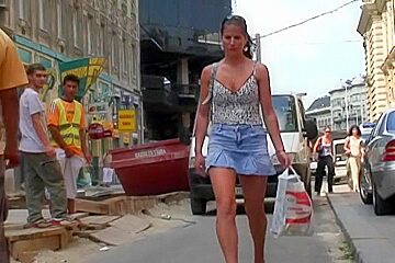  Vid Of A Brunette Babe In A Jean Skirt Walking Around...