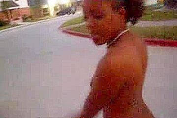 Curly black slut walks naked around the neighborhood