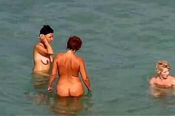 Three women naked at nudist beach...