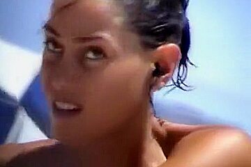 Debora Bello topless at the beach