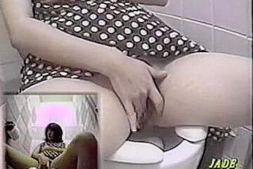 A Naughty Asian Masturbates In Toilet Cabin...