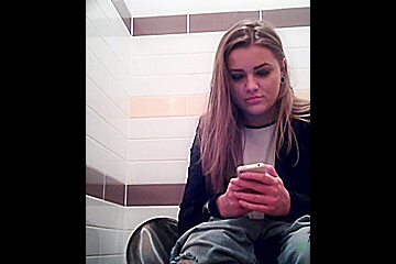 Amateur Girl Is Playing With Phone Pissing On Toilet...