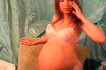 I’m a pregnant slut posing on cam