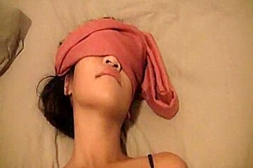 Blindfolded girl with a received a...