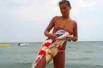Amateur brute from Romania playing topless at the beach