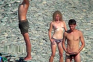 Nudist girls expose bodies beach...
