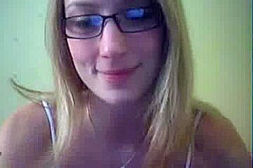 Geeky web cam girl stripping her...
