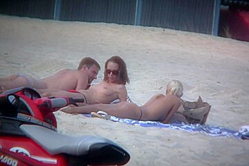 Sexy blonde and naughty brunette beach...