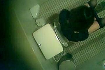 Asian girls go pissing under a bathroom spy camera