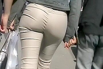 Nice Shot Of Tight Beige Pants On A Sexy Ass...