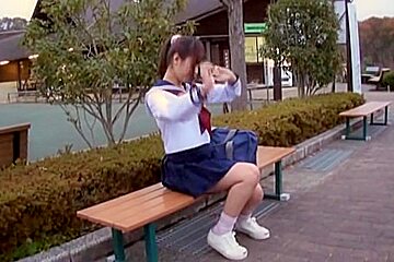 Sexy schoolgirl upskirt sitting on the park bench view
