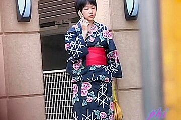 Black haired small geisha flashes her...