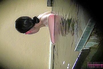 Asian girl standing in water and showing their tits su2664