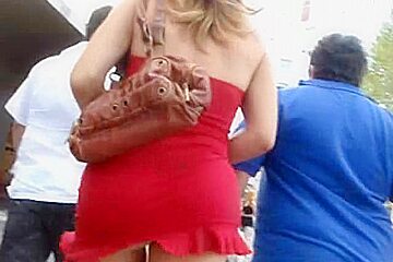 Blonde in red dress showing butt...
