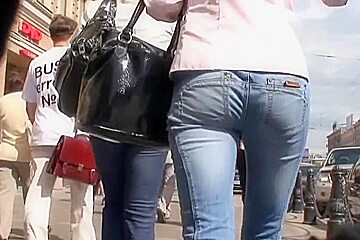 Young girl with long legs and elastic ass in the street candid scene