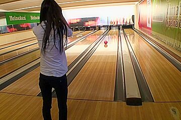Girl gives ultimate a bowling alley...