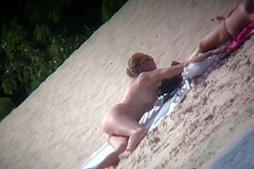 Nude blonde babe sunbathing caught...
