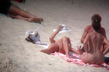 Stunning Women Relaxing Naked Sunny Beach...