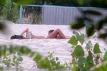Voyeur tapes 2 nudist couples beach...