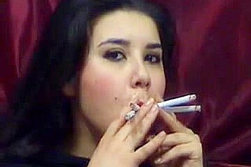 Hottie smokes multiple cigarettes...