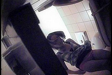 Sensual wench in a dress exposing her ass on toilet camera