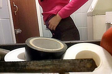Slim chick bares her ass in front of a toilet camera