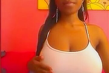 Black girl teases with huge boobs...